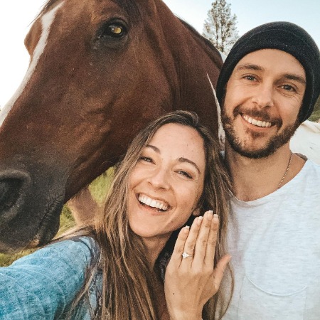 Courtney Prather flaunts her engagement ring. 